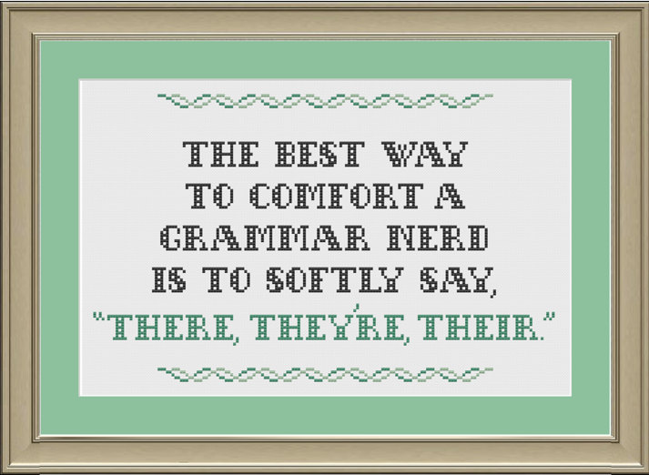 A crochet board that says ''The best way to comfort a grammar nerd is to softly say, 'There, they're, their.'''